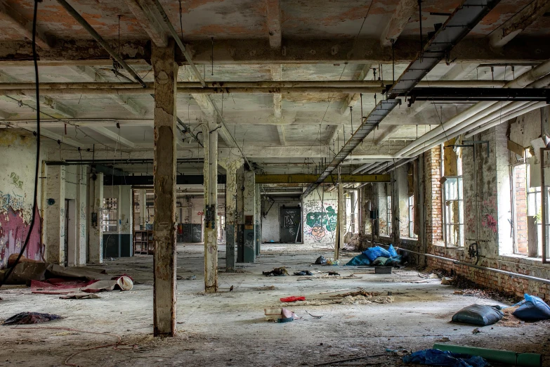 a run down building with graffiti all over it, unsplash contest winner, process art, large open room, sprawled out, ignant, 2 0 5 6