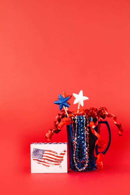 a vase filled with red, white and blue decorations, pexels, american realism, on a red background, miscellaneous objects, red flags holiday, state of the union