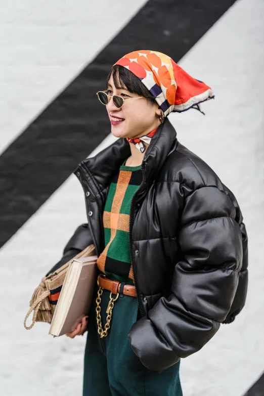 a woman in a black jacket and green pants, trending on unsplash, wearing beanie, junya watanabe, jinyoung shin, 🚿🗝📝