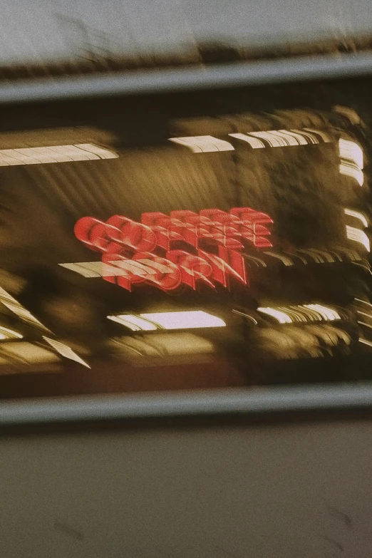 a sign that is on the side of a train, inspired by Nan Goldin, unsplash contest winner, computer art, zombie coffee logo, still from blade runner (1982), reflection lumen mapping, ron cobb. cinestill