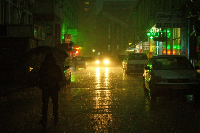 a person walking in the rain with an umbrella, inspired by Elsa Bleda, pexels, australian tonalism, neon green lava streets, humid evening, yellow lights, cyberpunk aesthetic