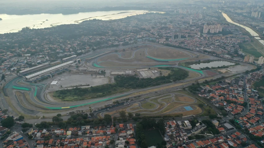 an aerial view of a race track in a city, by Felipe Seade, reddit, hurufiyya, jair bolsonaro, low quality photo, square, f 1