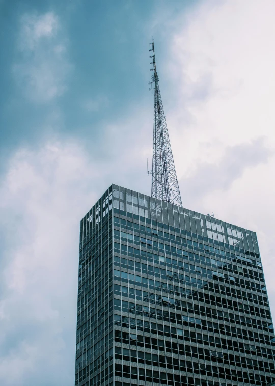 a tall building with a tower on top of it, unsplash, modernism, radio, low quality photo, from wheaton illinois, fan favorite