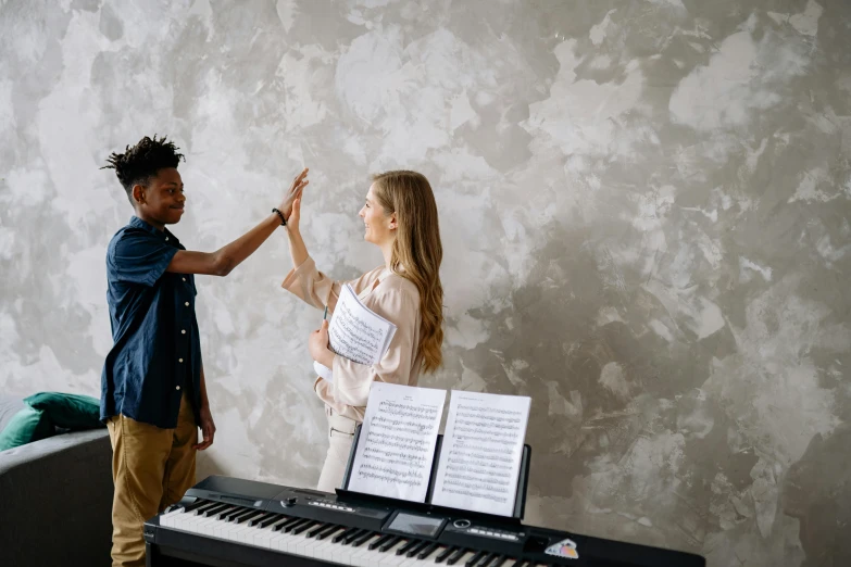 a man and a woman standing in front of a piano, pexels contest winner, hands reaching for her, gen z, diverse, promo image