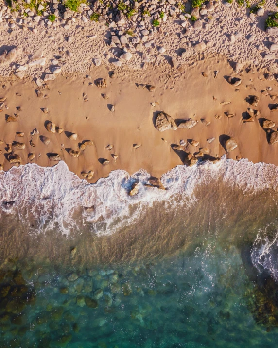 a bird's eye view of a sandy beach, pexels contest winner, lgbtq, manly, wall of water either side, up close