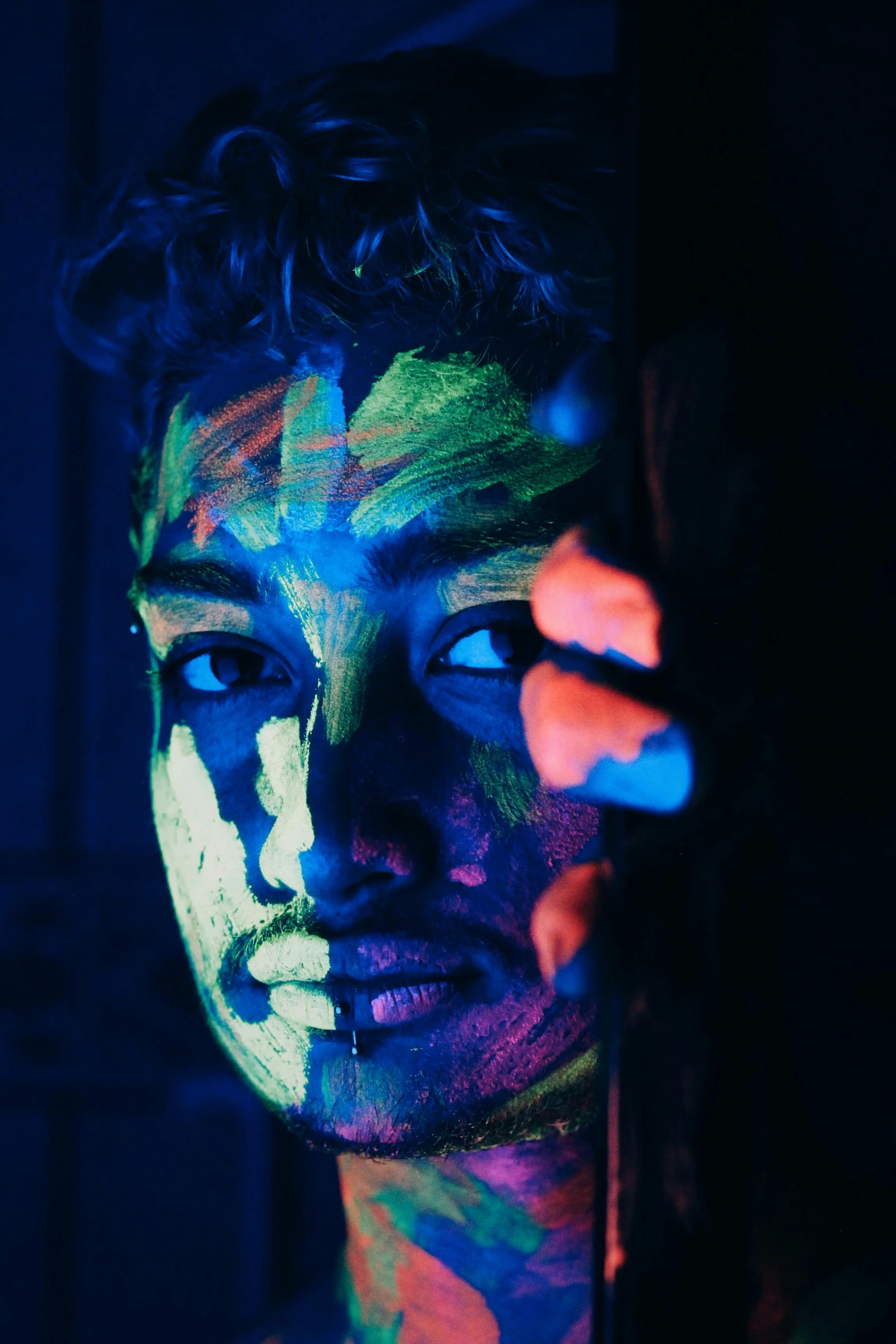 a close up of a person with fluorescent paint on their face, interactive art, spotlight in middle of face, intricate oil pastel glow, photoshoot, high contrast colors