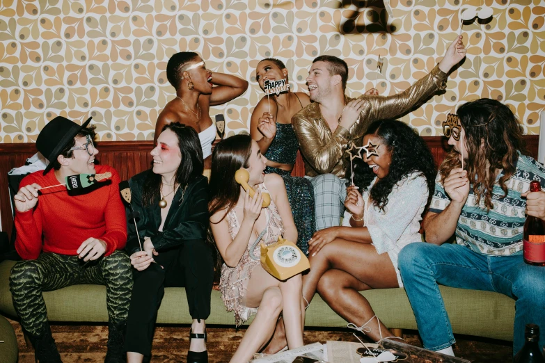 a group of people sitting on top of a couch, a portrait, trending on pexels, maximalism, disco party, milk bar magazine, profile image, posing for a picture