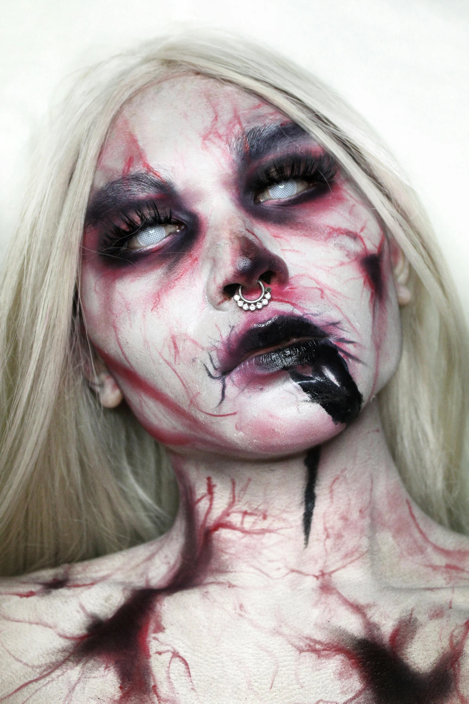 a close up of a woman with blood on her face, an album cover, inspired by Ignacy Witkiewicz, trending on deviantart, gothic art, ahegao, singularity sculpted �ー etsy, septum piercing, hauntingly beautiful zombie