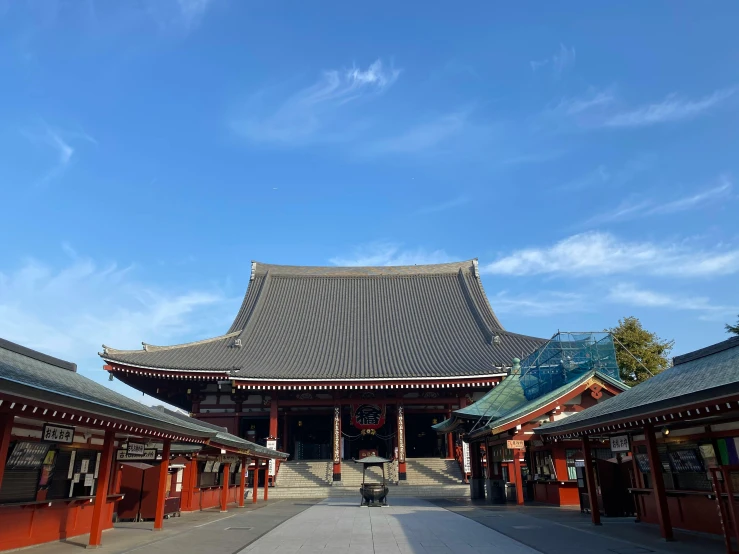 a person riding a scooter in front of a building, inspired by Itō Jakuchū, unsplash, giant majestic archways, square, deity), high quality image