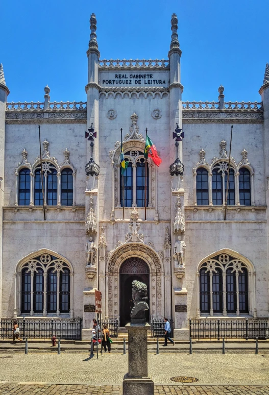 a large building with a statue in front of it, a picture, portugal, gothic library, front facing, artsationhq