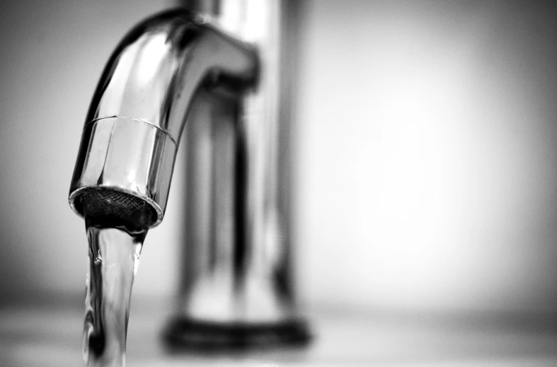 a close up of a faucet with water coming out of it, a black and white photo, pexels, conceptual art, highly polished, about to consume you, finely detailed, digitally drawn