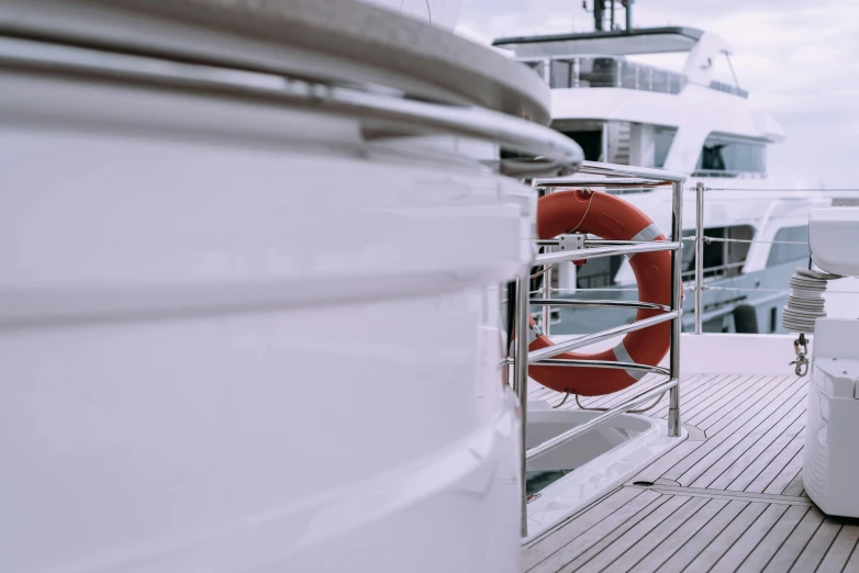 a boat with a life preserver on the deck, pexels contest winner, modernism, on a super yacht, low quality photo, thumbnail, shot on sony a 7