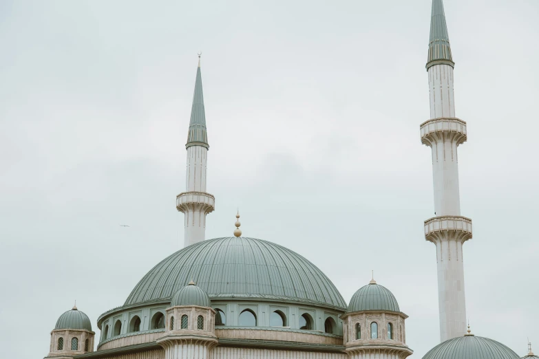 a couple of people that are standing in front of a building, pexels contest winner, hurufiyya, neoclassical tower with dome, white and teal metallic accents, islam, bosnian