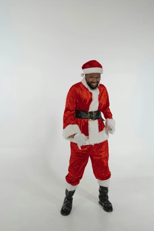 a man in a santa suit poses for a picture, an album cover, pexels, mkbhd, full body action pose, ( ( theatrical ) ), gif