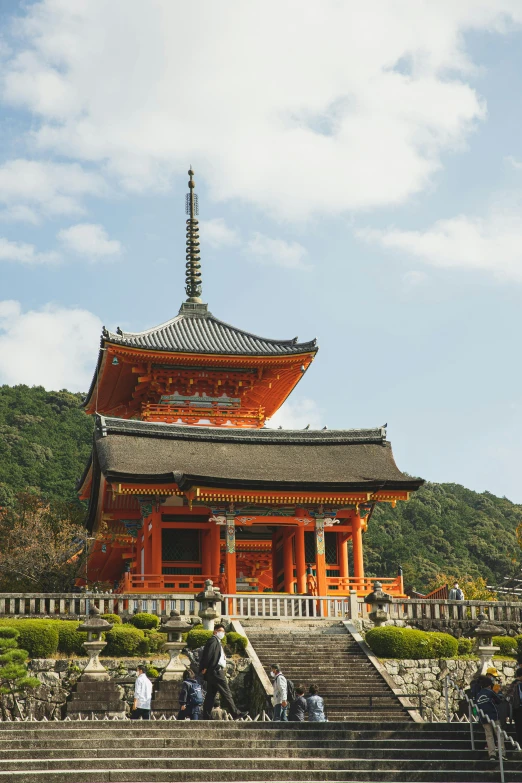 a group of people that are standing in front of a building, a picture, inspired by Torii Kiyomasu, trending on unsplash, pagodas on hills, square, japonisme 3 d 8 k ultra detailed, ethnicity : japanese