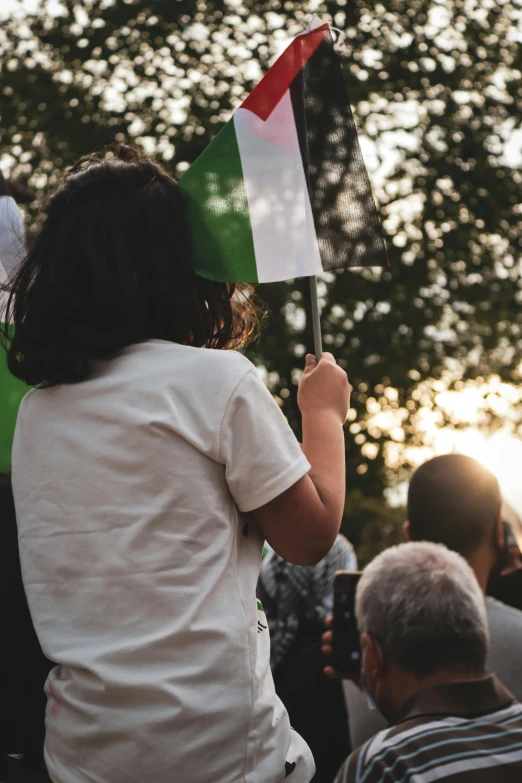 a group of people standing next to each other holding flags, pexels contest winner, renaissance, girl watching sunset, green and white, giving a speech, italian flag