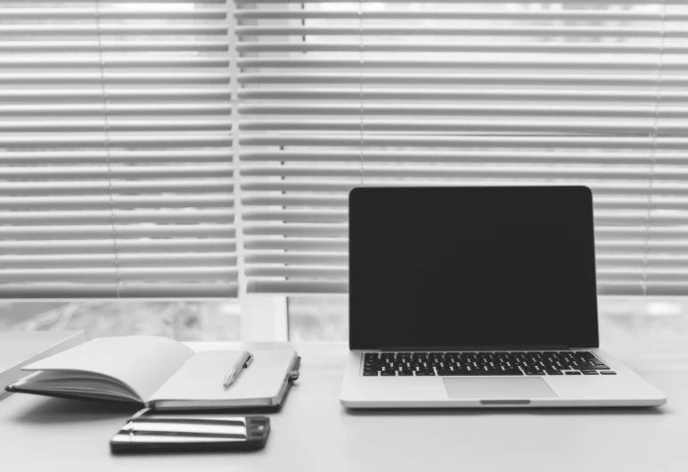 a laptop computer sitting on top of a white desk, a black and white photo, by Romain brook, pexels, clean and empty, scientific study, set inside of office, detailed »