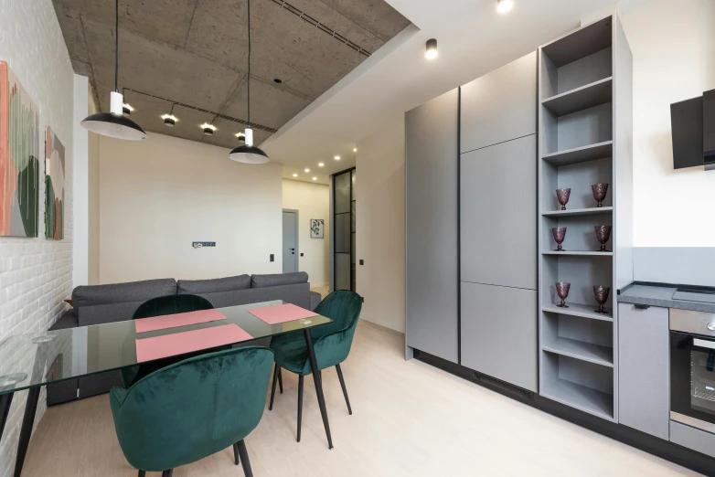 a living room filled with furniture and a dining table, by Adam Marczyński, light and space, located in hajibektash complex, professional studio, minimal kitchen, tourist photo