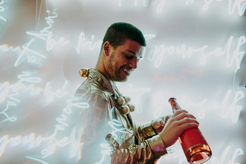 a man that is holding a bottle of wine, pexels contest winner, holography, zayn malik, bubbly scenery, with red haze and a massive grin, liquid gold