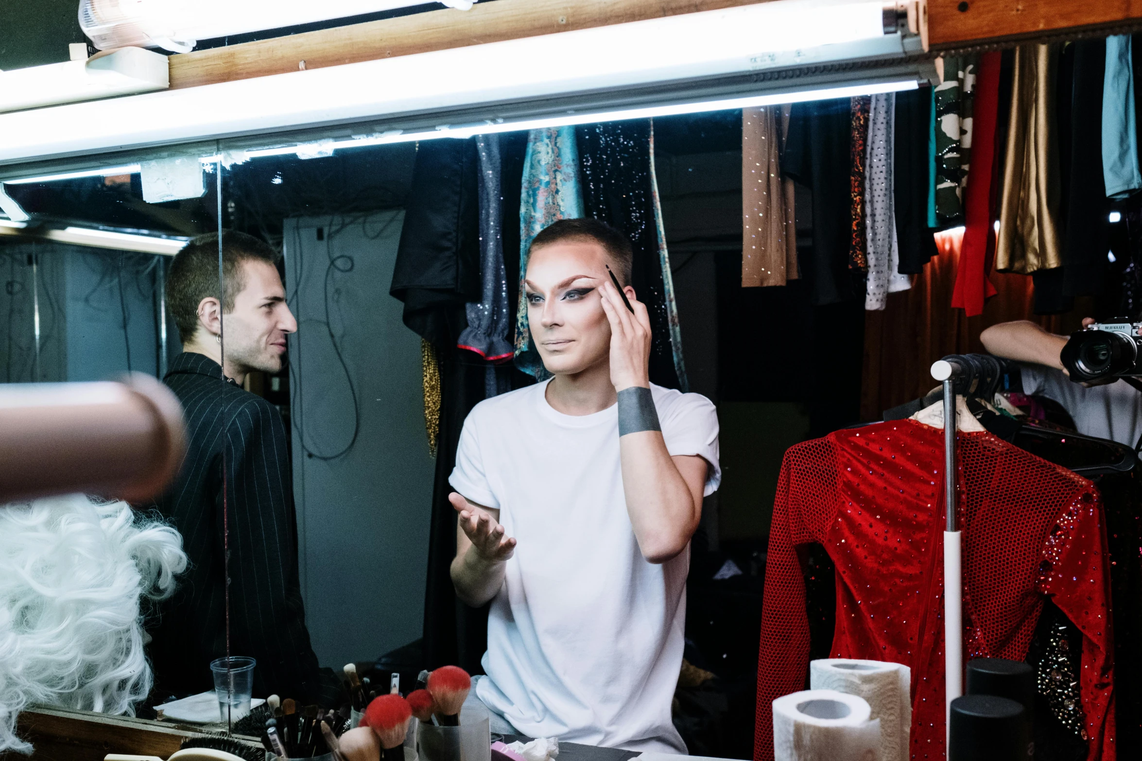 a woman that is standing in front of a mirror, lots of makeup, concert photo, alexander abdulov, theater dressing room