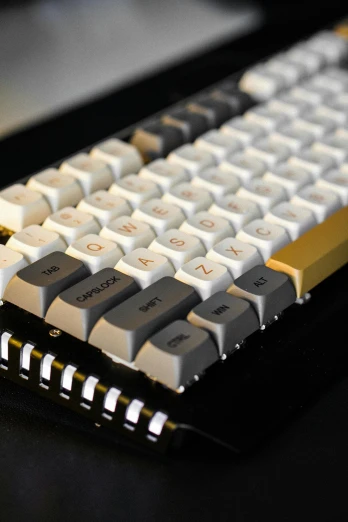 a computer keyboard sitting on top of a desk, brown and white color scheme, tinkercore, hundreds of them, press shot
