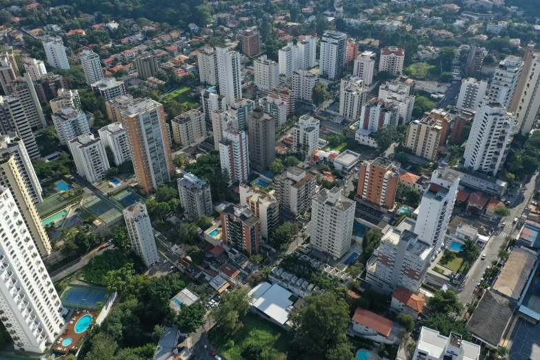 an aerial view of a city with lots of tall buildings, by Fernando Gerassi, pexels, hyperrealism, brazilian, mass housing, helio oiticica, 2000s photo