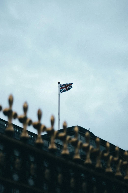 a british flag flying on top of a building, unsplash, square, royal photo, the iron lady, high picture quality