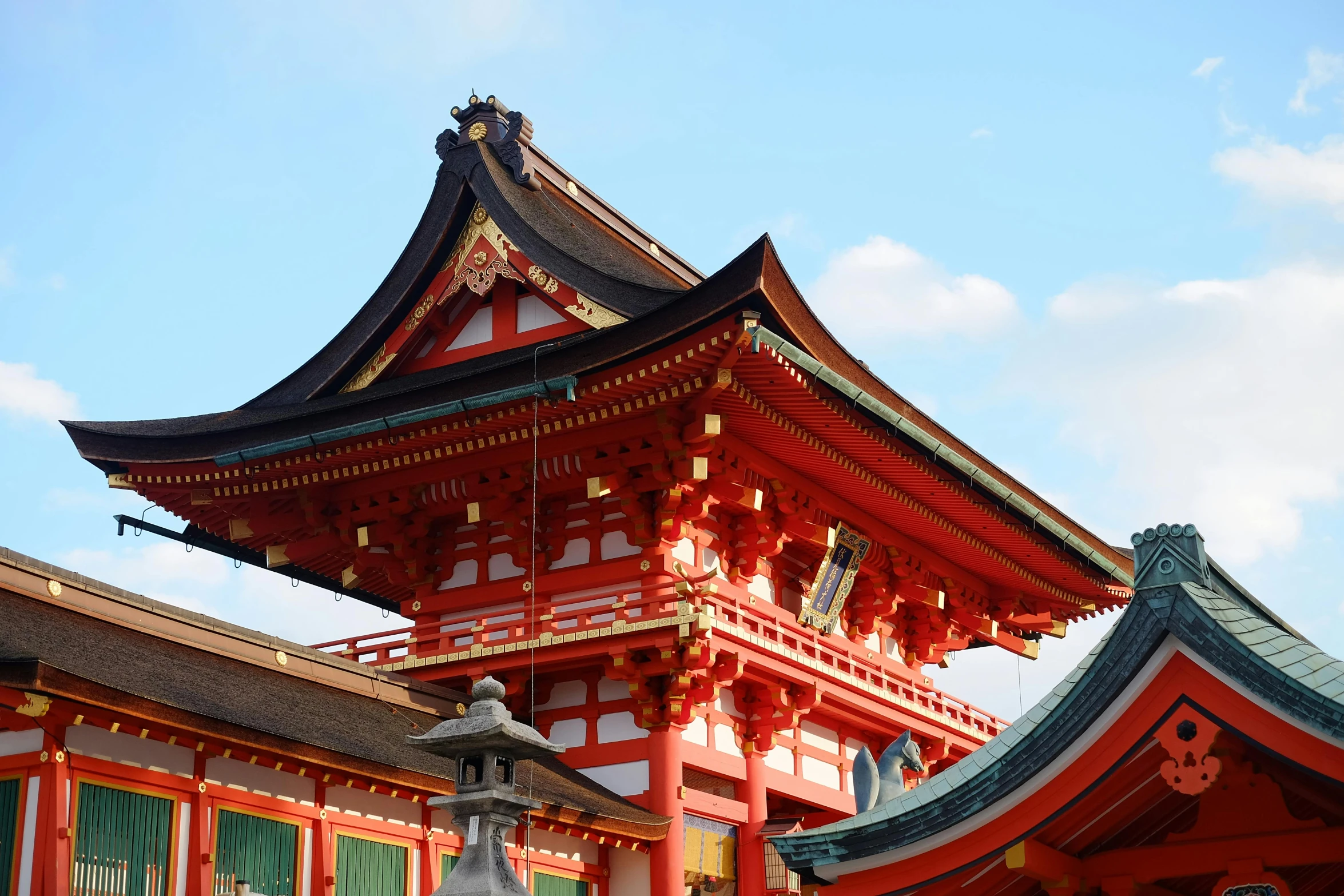 a tall red building sitting on top of a lush green field, inspired by Torii Kiyomasu, trending on unsplash, sōsaku hanga, ornate tiled architecture, 🦩🪐🐞👩🏻🦳, classical architecture, exterior view