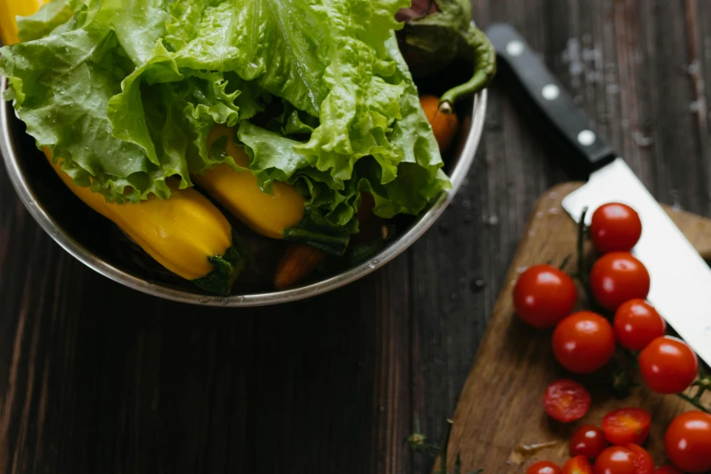 a bowl of lettuce and tomatoes on a cutting board, by Sebastian Vrancx, pexels, yellow and greens, avatar image, listing image, thumbnail
