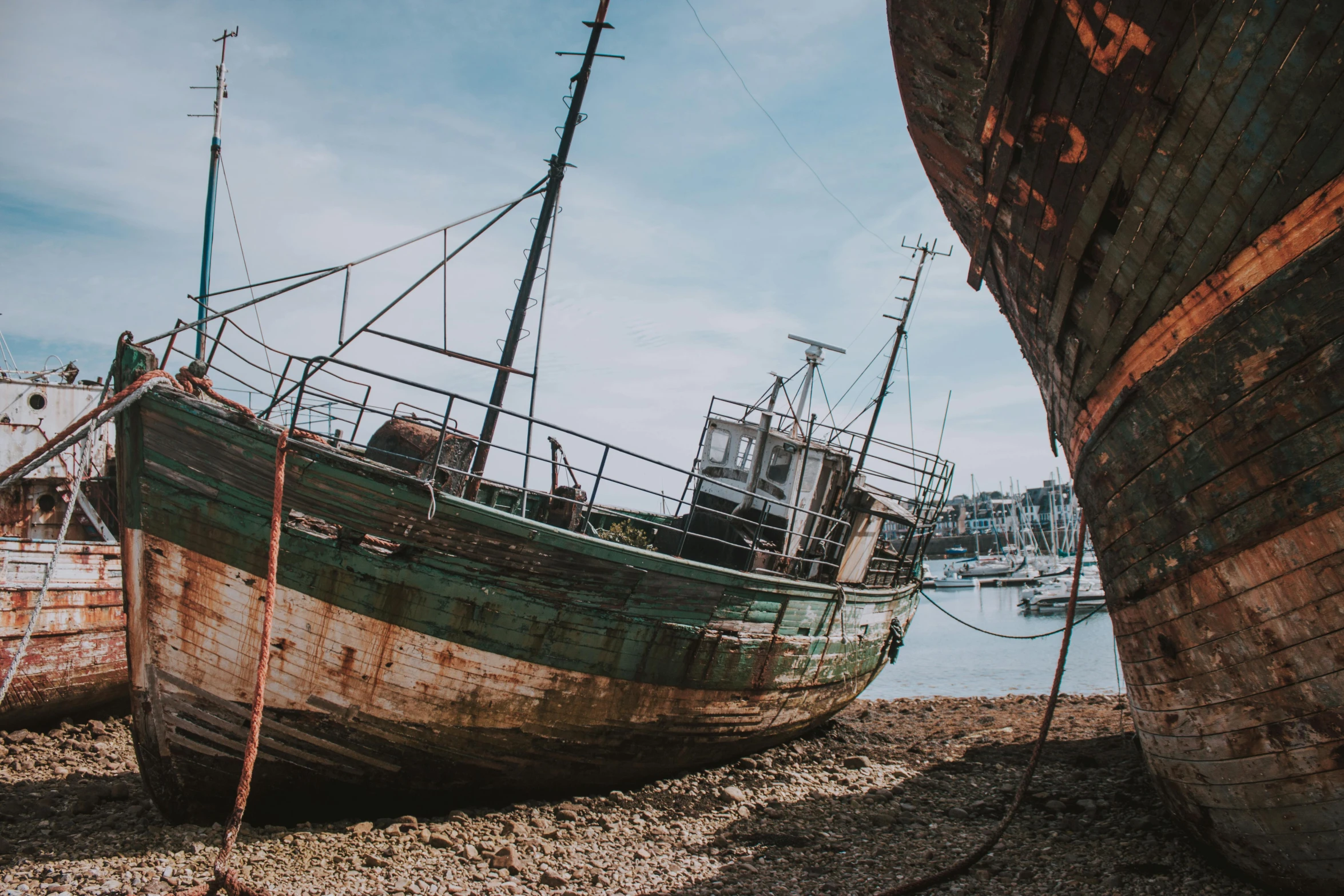 a couple of boats sitting on top of a beach, pexels contest winner, auto-destructive art, rusted steel, unsplash 4k, scylla and charybdis, low angle shot