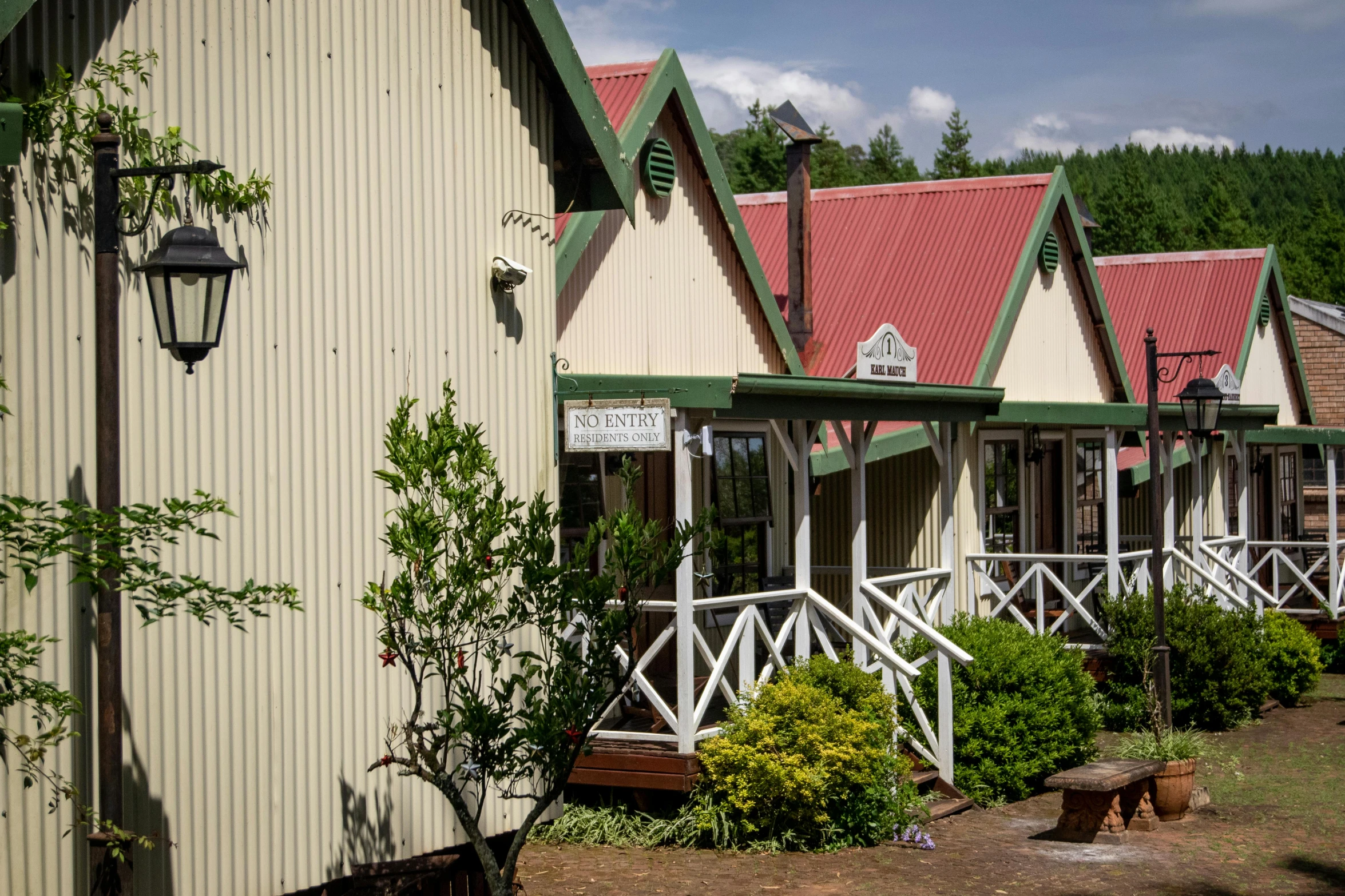 a row of houses sitting next to each other, chalet, entrance, te pae, nostalgic atmosphere