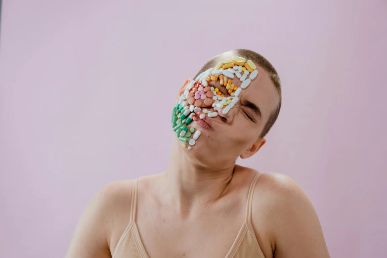 a woman with a lot of pills on her face, inspired by Damien Hirst, trending on pexels, emaciated shaved face, milk bar magazine, portrait of max caulfield, face muscles