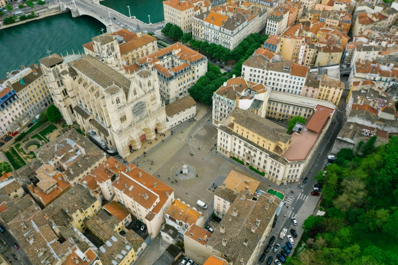 an aerial view of a city with lots of buildings, a picture, pexels contest winner, renaissance, prefecture streets, gothic cathedral, 2022 photograph, square