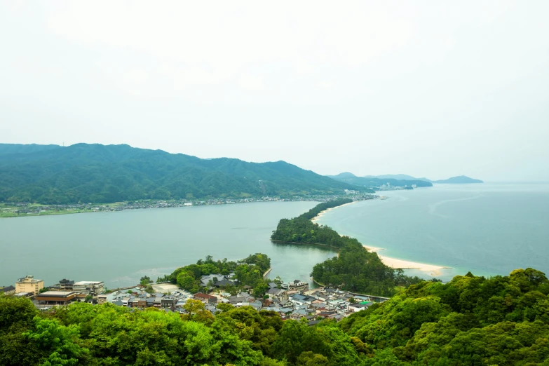a large body of water surrounded by trees, inspired by Maruyama Ōkyo, unsplash, mingei, tropical coastal city, tankoban, multiple stories, conde nast traveler photo