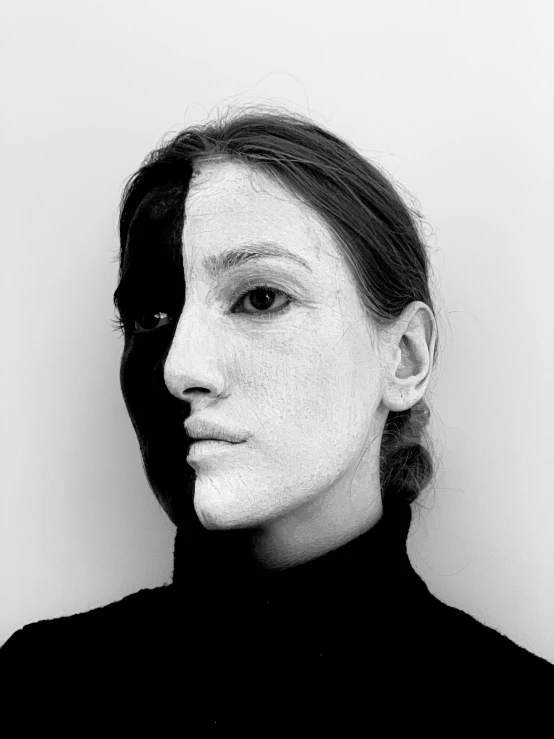 a woman with white paint on her face, a black and white photo, inspired by Marina Abramović, half robot and half woman, andrei riabovitchev symmetrical, profile image, half and half