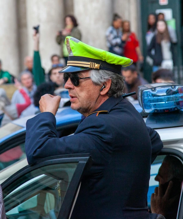 a man sitting in the drivers seat of a police car, by Carlo Martini, pexels contest winner, renaissance, pride parade, italian looking emma, square, 🚿🗝📝