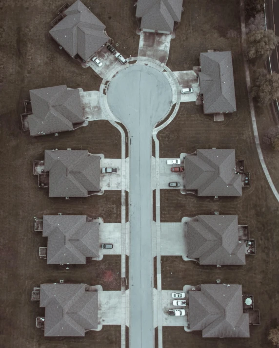 a bird's eye view of a residential area, by Carey Morris, pexels contest winner, symmetrical shot, desaturated, high quality photo, very accurate photo