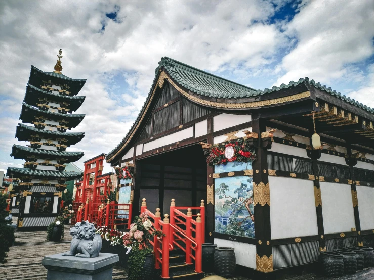 a building with a pagoda in the background, a colorized photo, inspired by Itō Jakuchū, pexels contest winner, ukiyo-e, colorful tiled architecture, quirky shops, mythical shrine, cloud palace