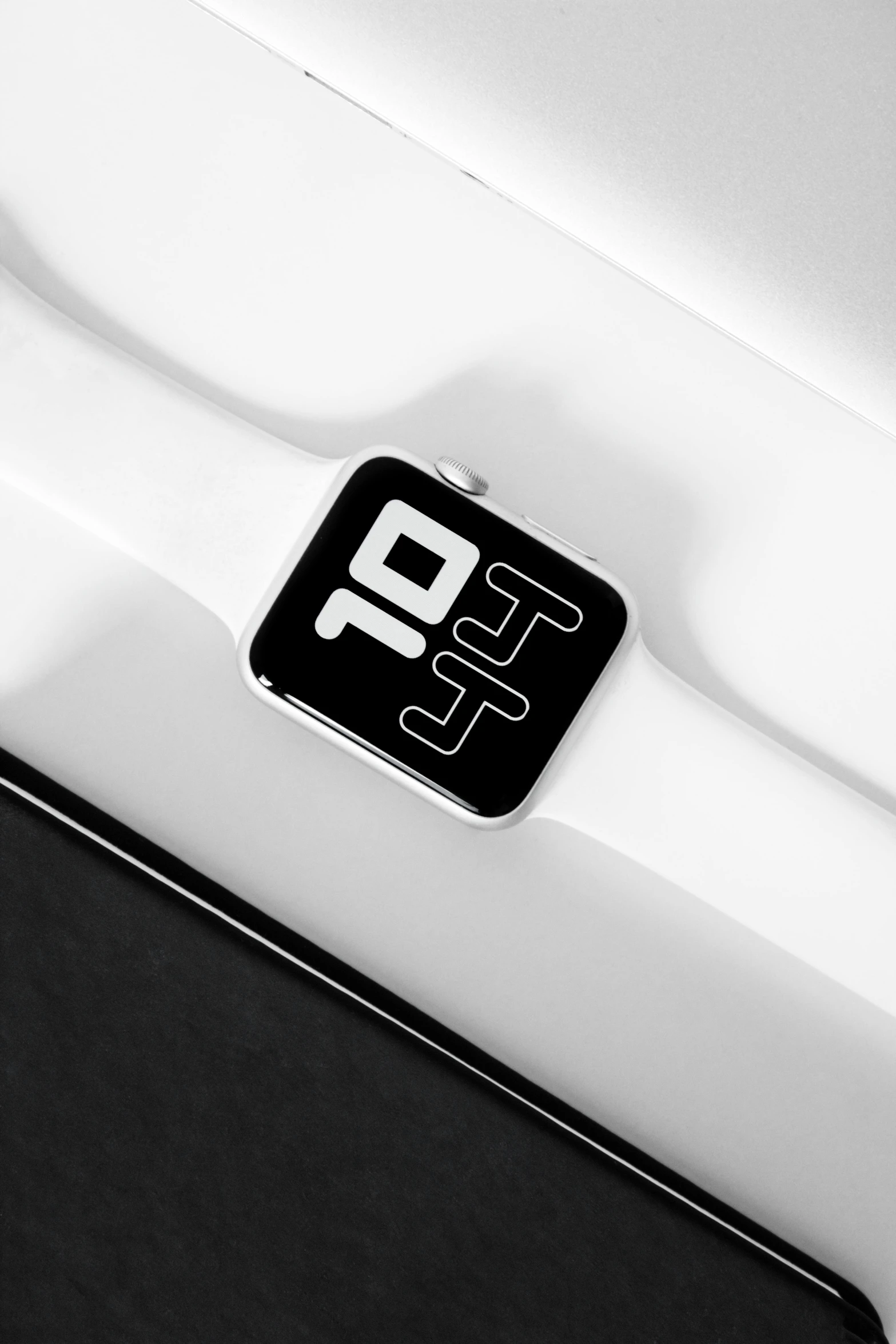 a black and white photo of an apple watch, inspired by Otto Abt, hypermodernism, logo has”, inhabited initials, 1 0, porsche