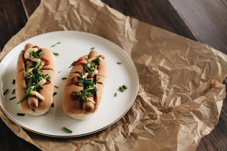 two hot dogs sitting on top of a white plate, unsplash, bauhaus, chinese, recipe, profile image, thumbnail