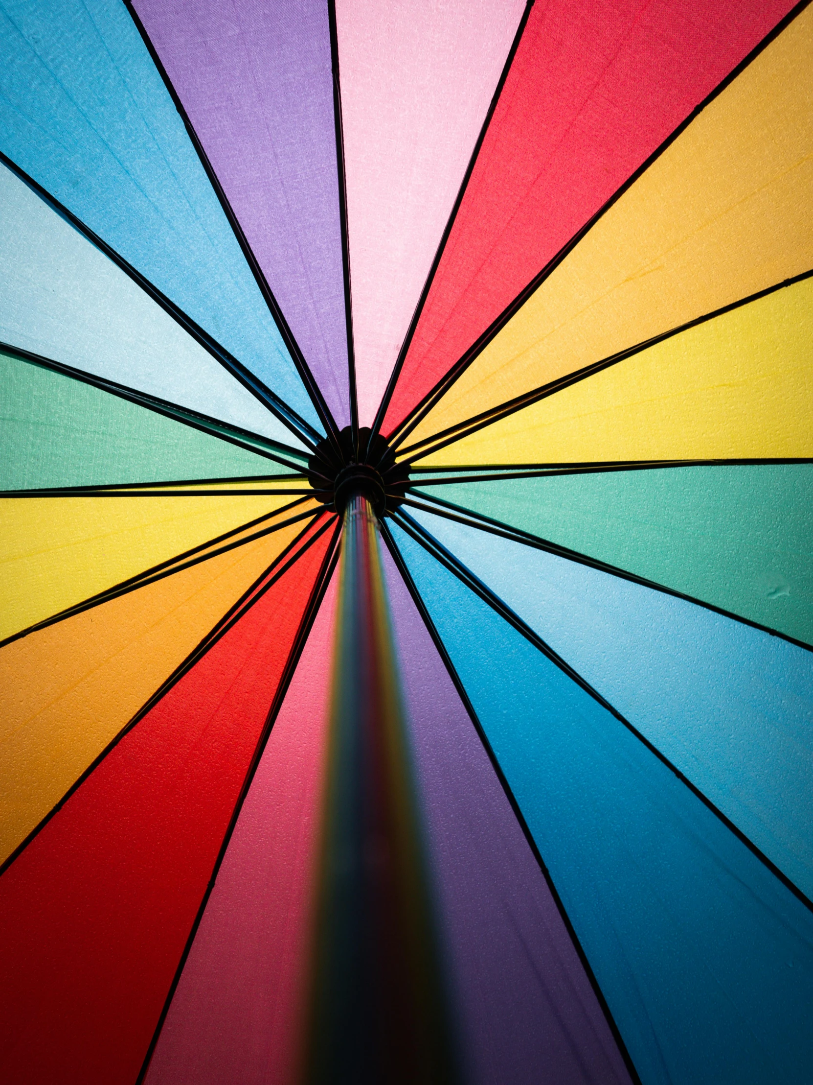 a close up of a rainbow colored umbrella, by Rachel Reckitt, unsplash, multiple stories, full frame image
