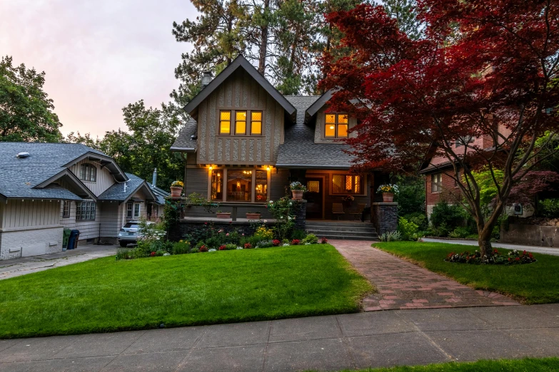 a house with a car parked in front of it, by Carey Morris, pexels contest winner, arts and crafts movement, twilight ; wide shot, lush lawn, neighborhood, majestic forest grove