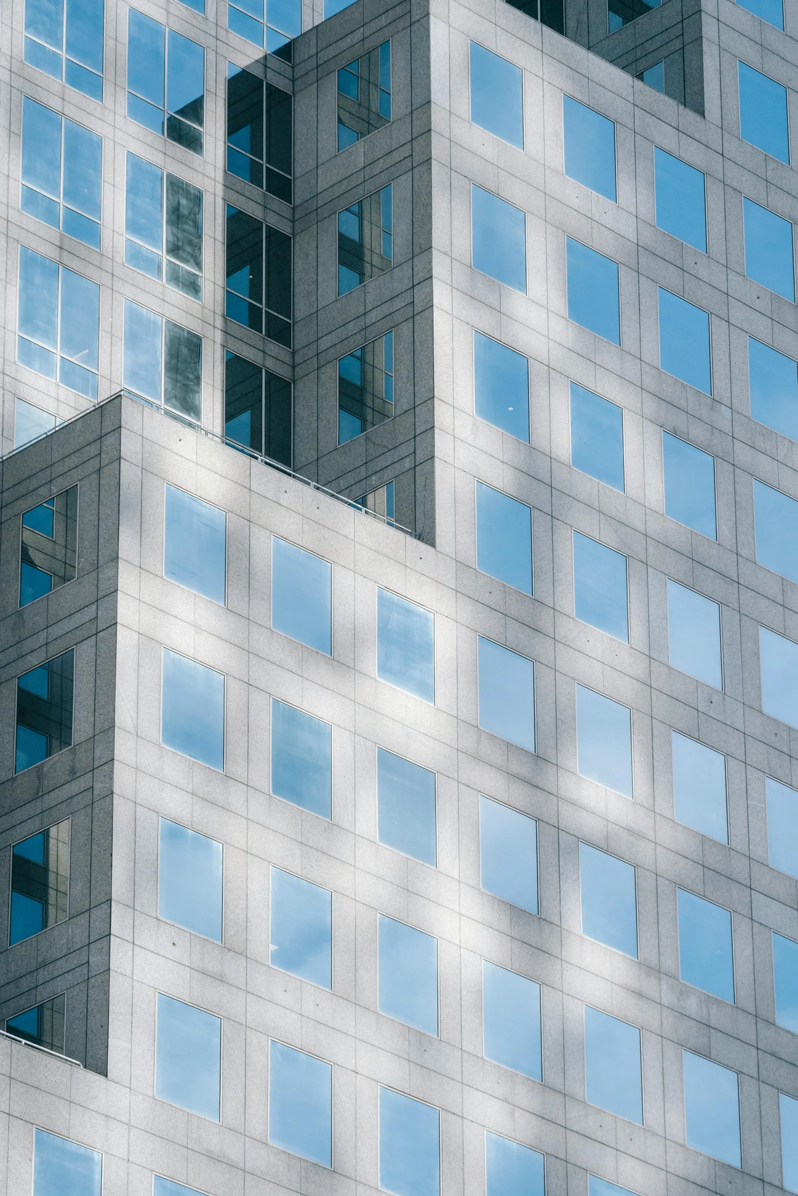 a very tall building with a lot of windows, pexels contest winner, light blues, square lines, commercial banner, photorealist