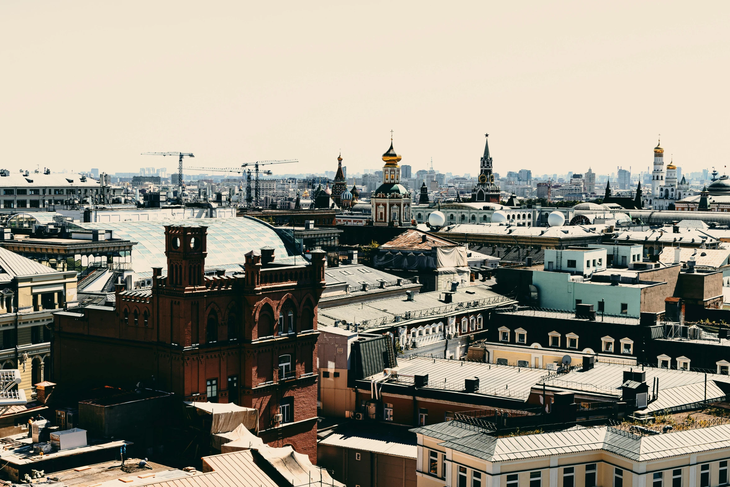 a view of a city from the top of a building, inspired by Illarion Pryanishnikov, pexels contest winner, baroque, hot summer day, 2 0 0 0's photo, 000 — википедия, plain background