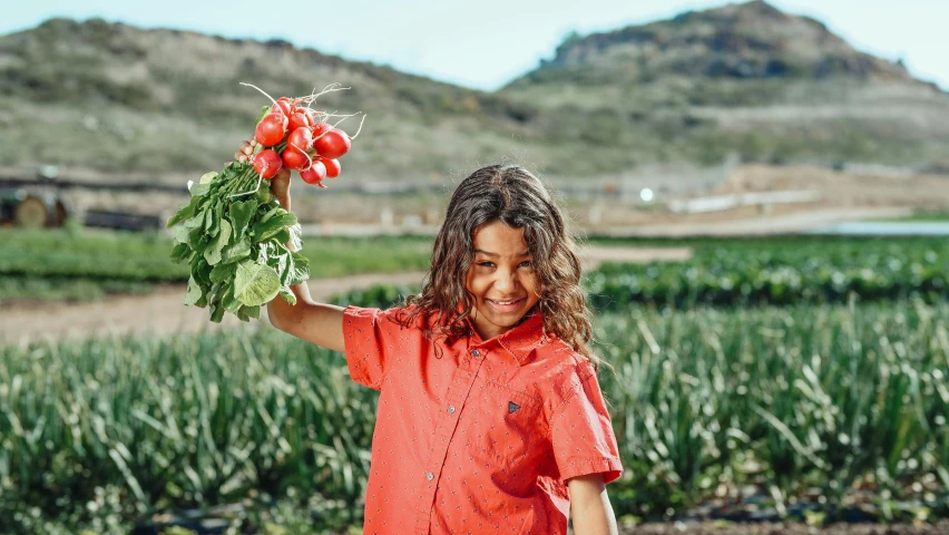 a young girl holding up a bunch of radishes, pexels contest winner, hollister ranch, avatar image, isabela moner, teen boy