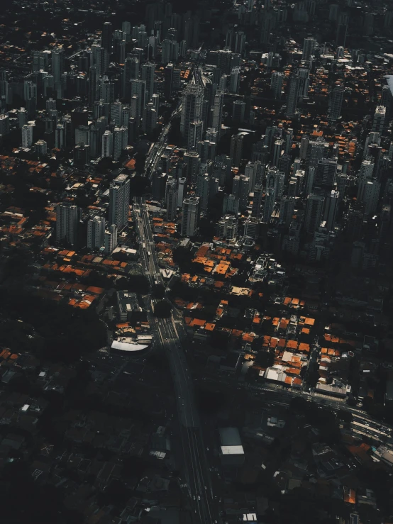 an aerial view of a city at night, an album cover, pexels contest winner, são paulo, tiled roofs, vancouver, low quality photo