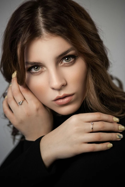 a woman with a ring on her finger, a photo, by Lucia Peka, attractive brown hair woman, shot with sony alpha, square, jewelry lighting