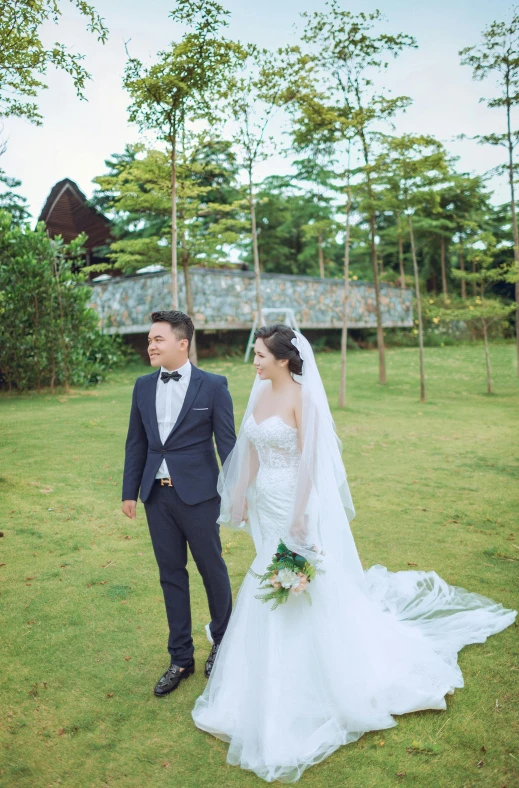 a bride and groom are standing in the grass, unsplash, happening, in style of lam manh, lush environment, album, wide long view