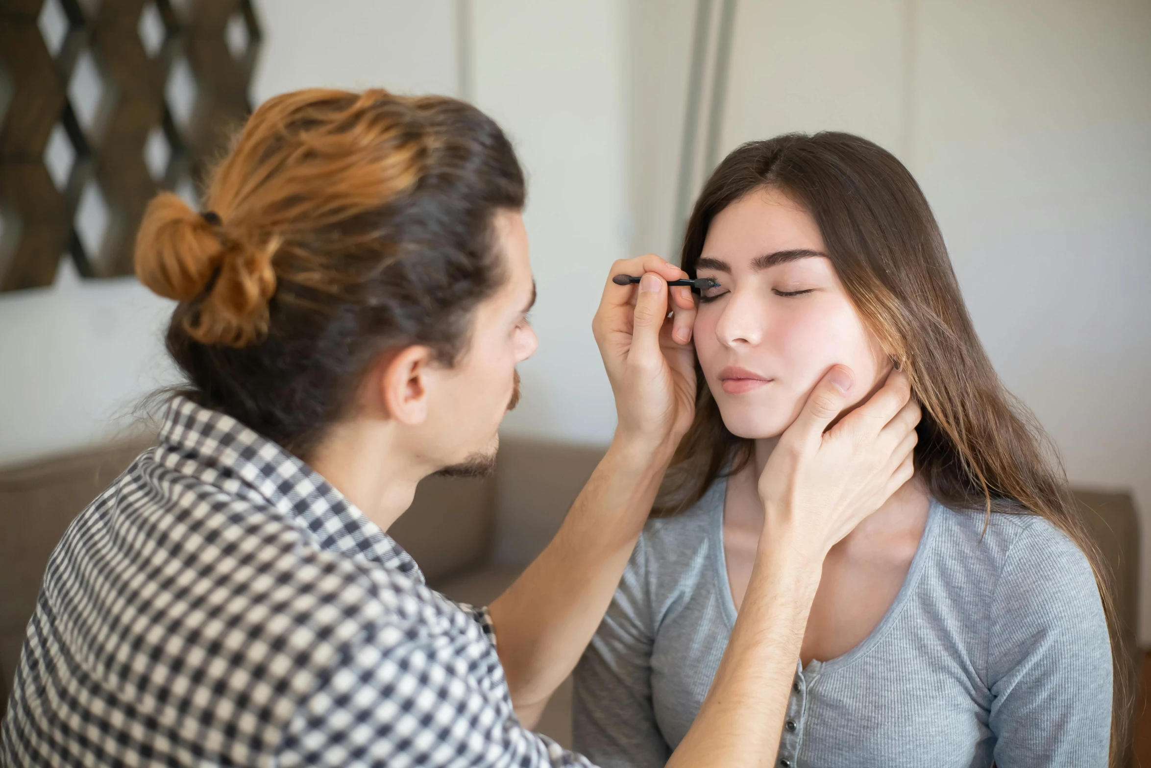 a woman putting makeup on another woman's face, trending on pexels, square facial structure, man, lachlan bailey, te pae