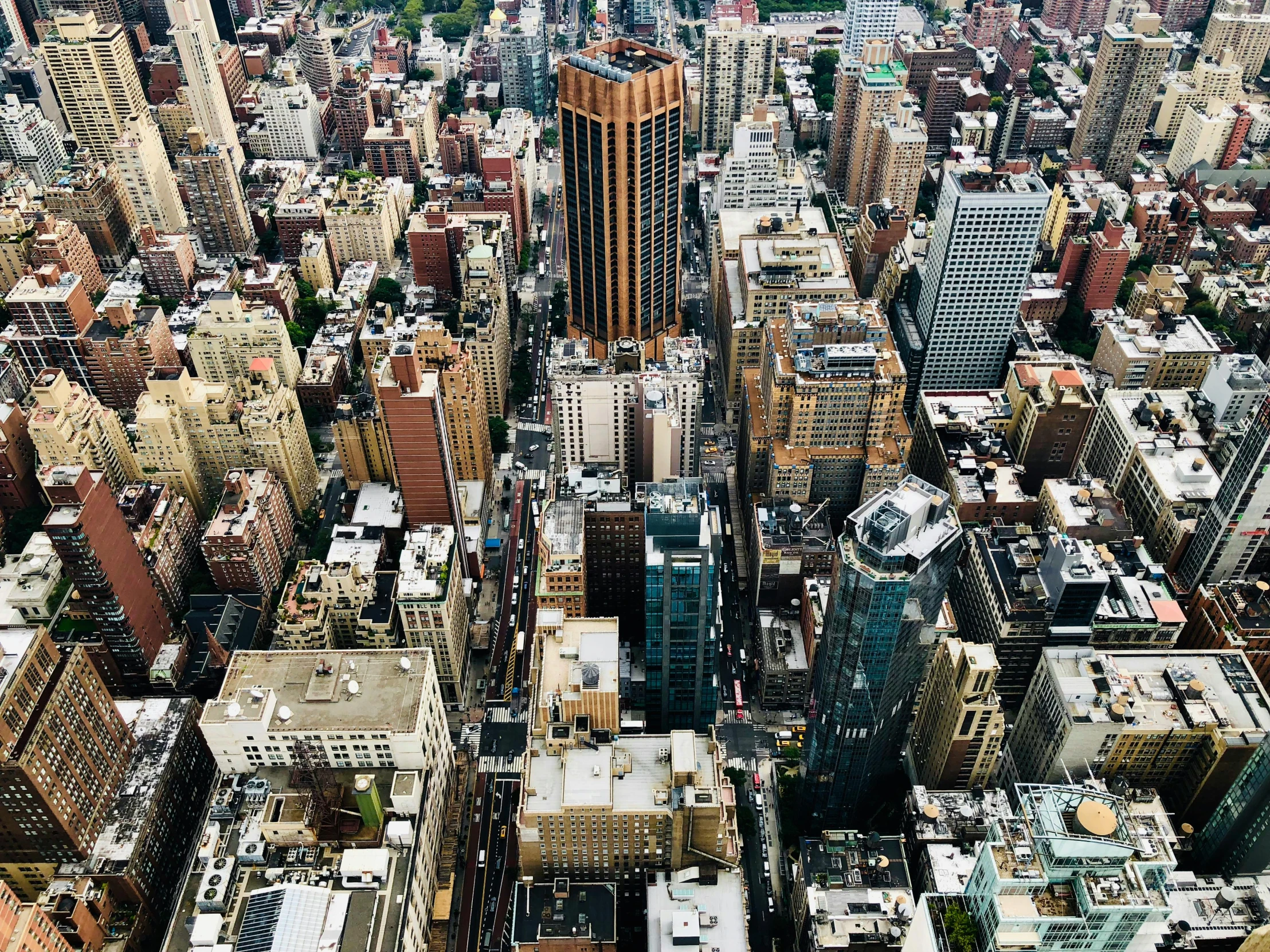 a view of a city from the top of a building, inspired by Thomas Struth, pexels contest winner, new york buildings, aerial shot from the drone, 2000s photo